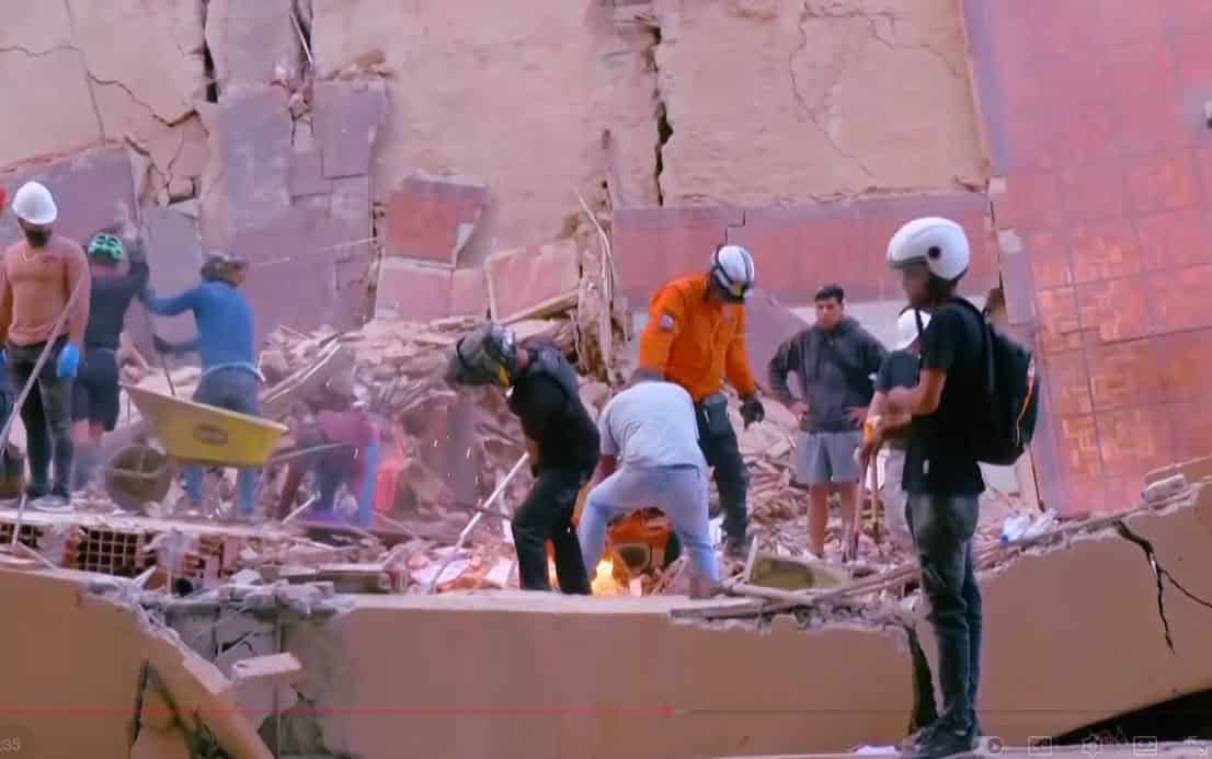 Rescue workers search through rubble in La Guaira Venezuela after June 2026 earthquake