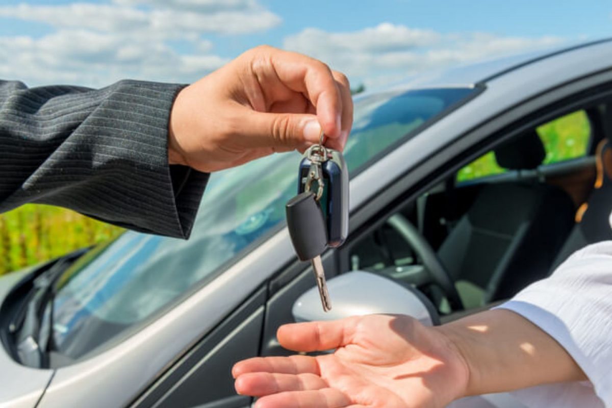 Buyer checking vehicle Registration Certificate and loan documents before purchasing a used car under bank loan in India